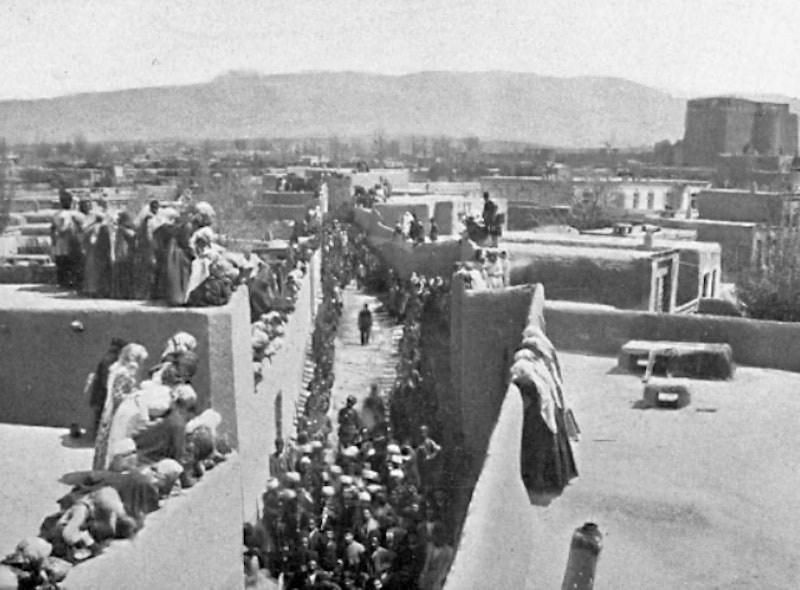 People stand atop buildings