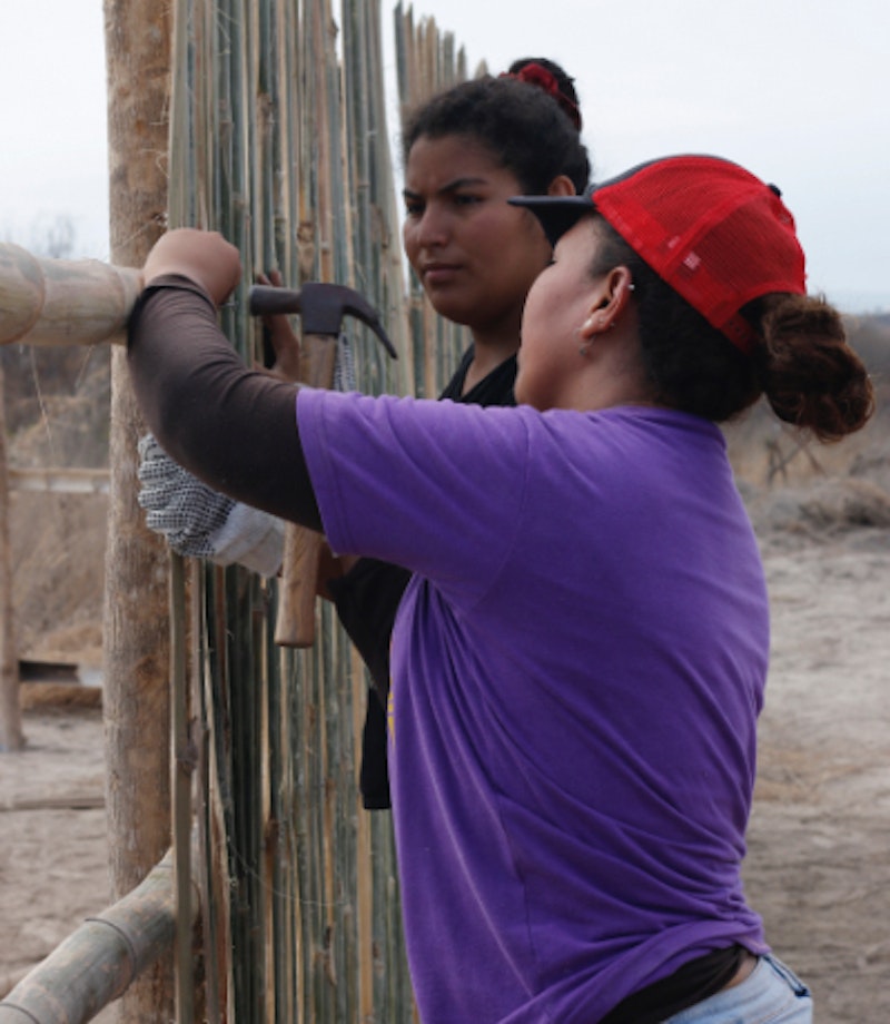 women making a fence